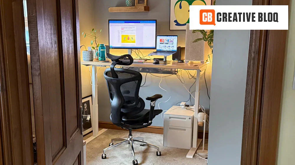 Home office setup with a budget-friendly ergonomic chair and standing desk, ideal for comfort and productivity.