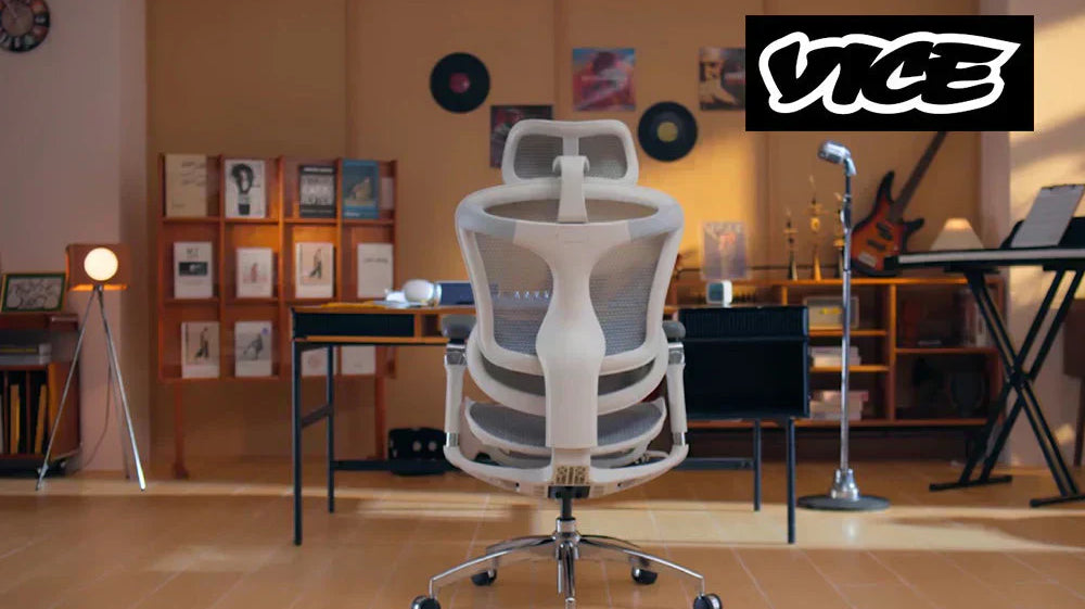 ack view of a SIHOO Doro C300 Pro ergonomic chair in a stylish home music studio setup with desk and guitar.