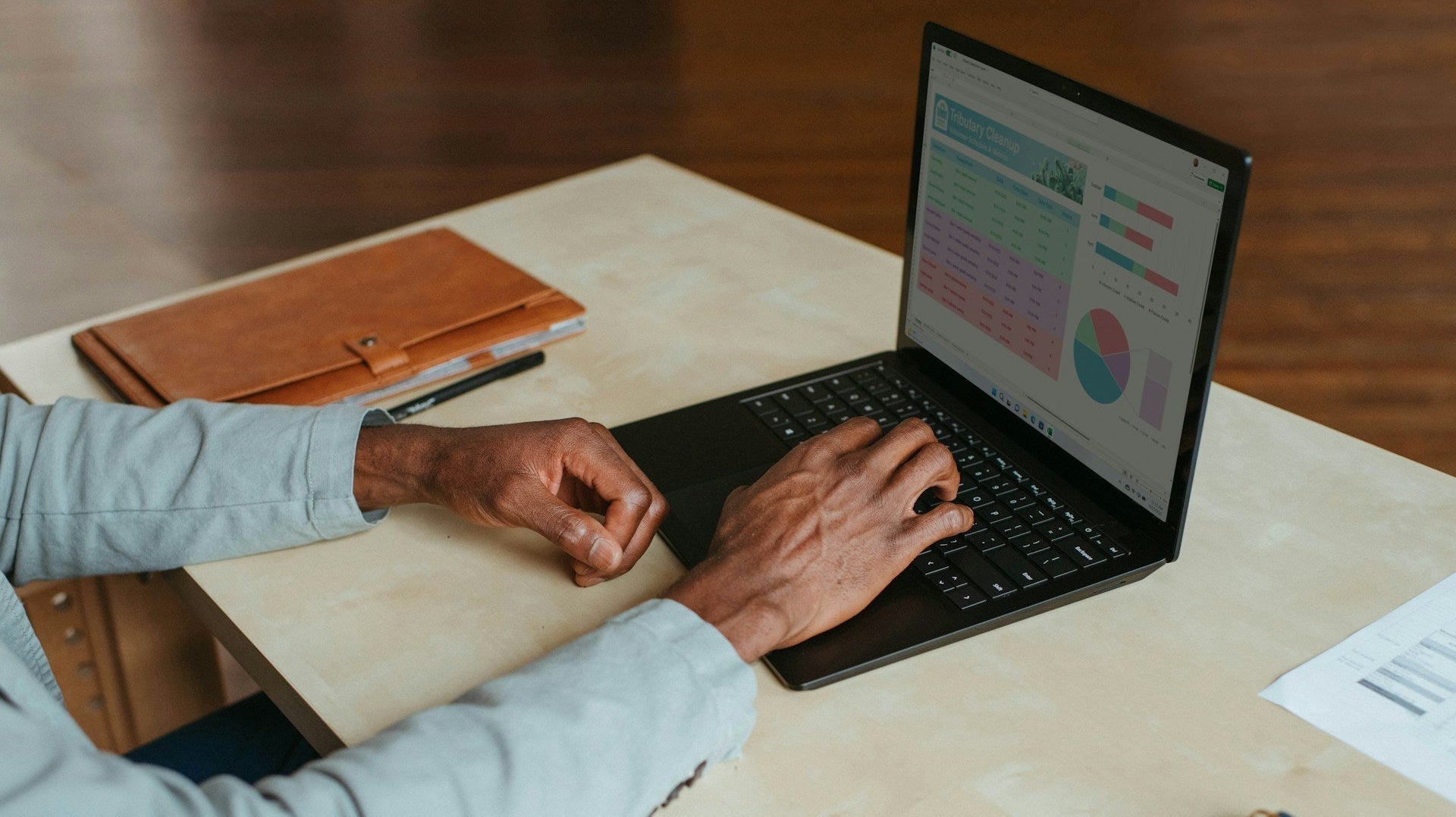 Person using a laptop at home, illustrating how a work-from-home setup might be ruining your posture.