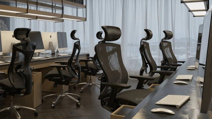 Ergonomic chairs arranged in a modern office workspace, demonstrating the benefits of ergonomic chair design for comfort, posture, and productivity.