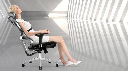 A lady sitting comfortably on the best ergonomic office chair in Australia, demonstrating proper posture and back support.