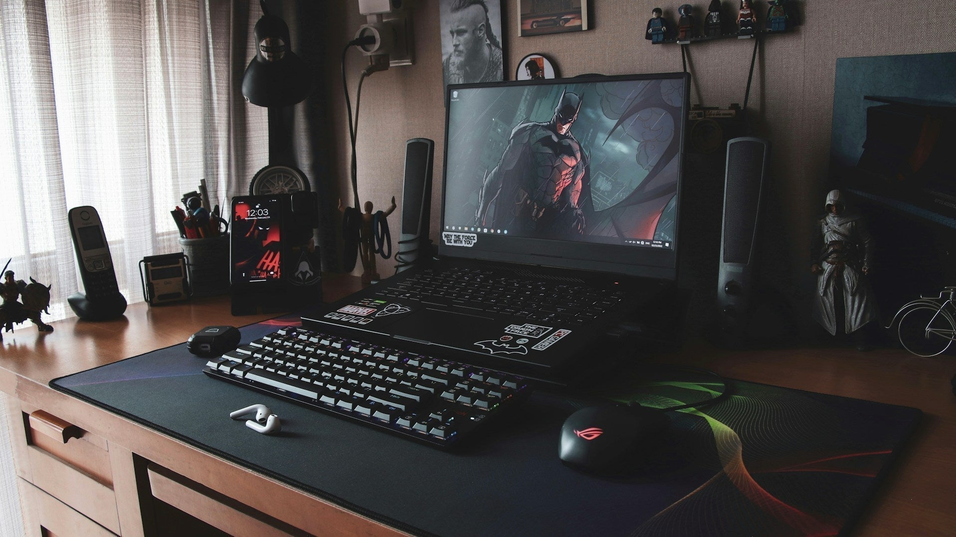 A gaming laptop on a table, highlighting the versatility of how a gaming laptop can be used for work and productivity tasks.