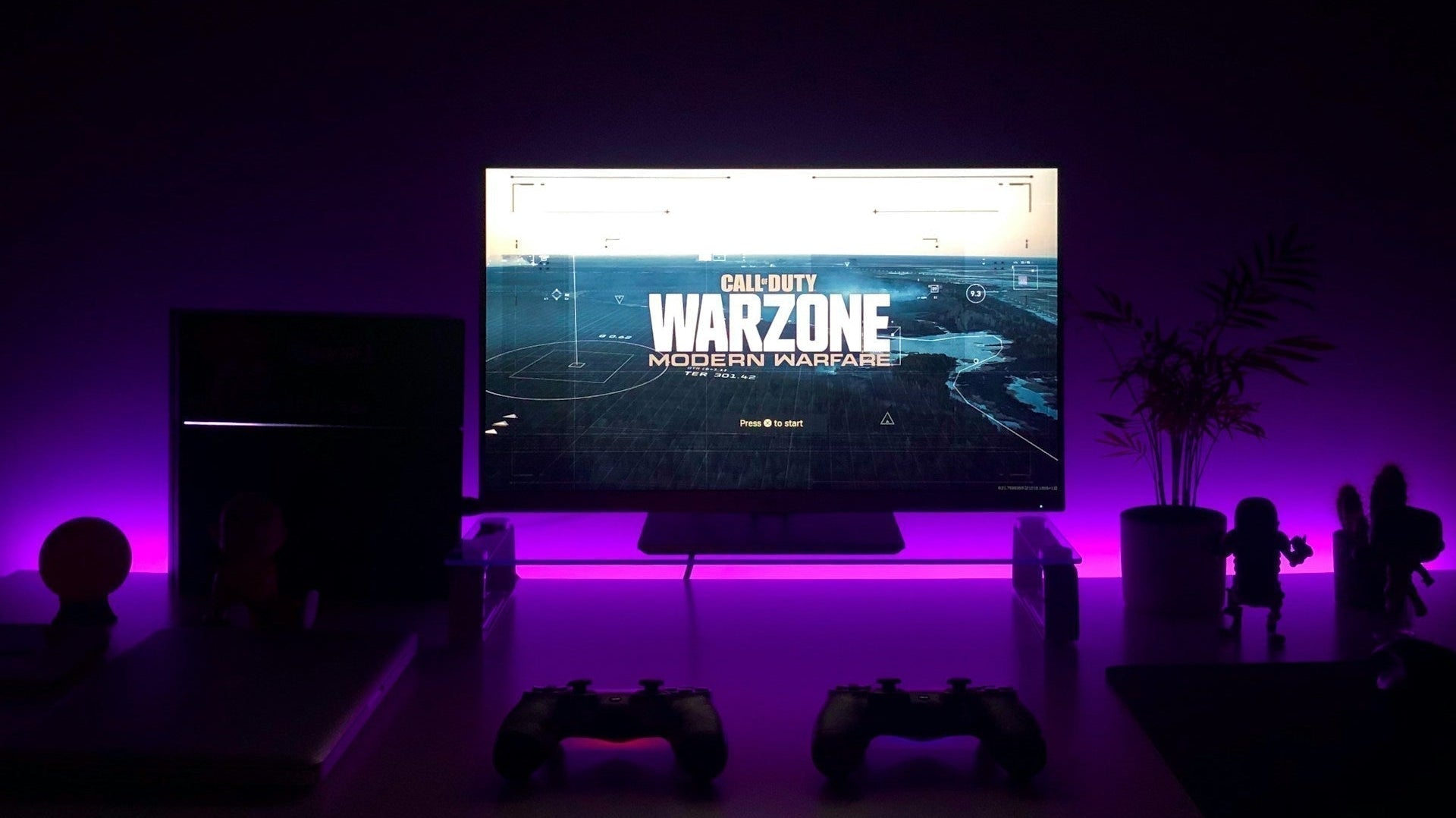 A dimly lit desk setup, with no cheap gaming chairs in sight. Photo by Fábio Magalhães on Unsplash