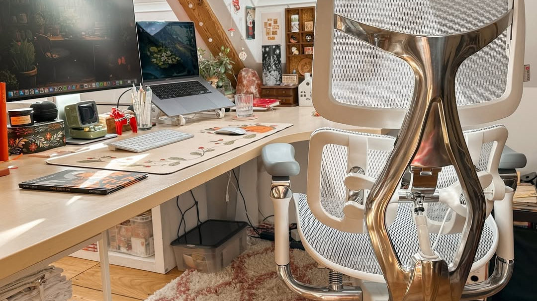Modern home office setup with ergonomic chair and wooden desk, perfect for transforming your space with a stylish home office makeover.