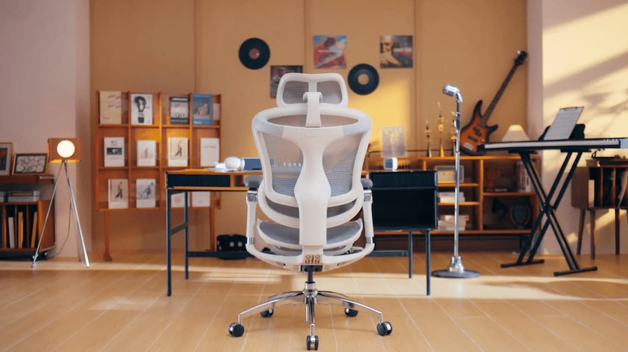 Sihoo ergonomic office chair placed in a creative home office and music studio setup, illustrating how ergonomics can be applied in the workplace.