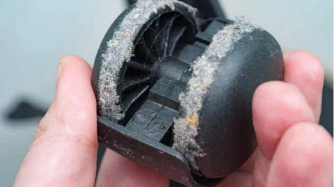 Close-up of office chair caster wheels showing how to remove caster wheels from an office chair