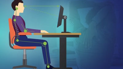 Side view of a man sitting in an adjusted office chair showing how to set up an ergonomic chair.