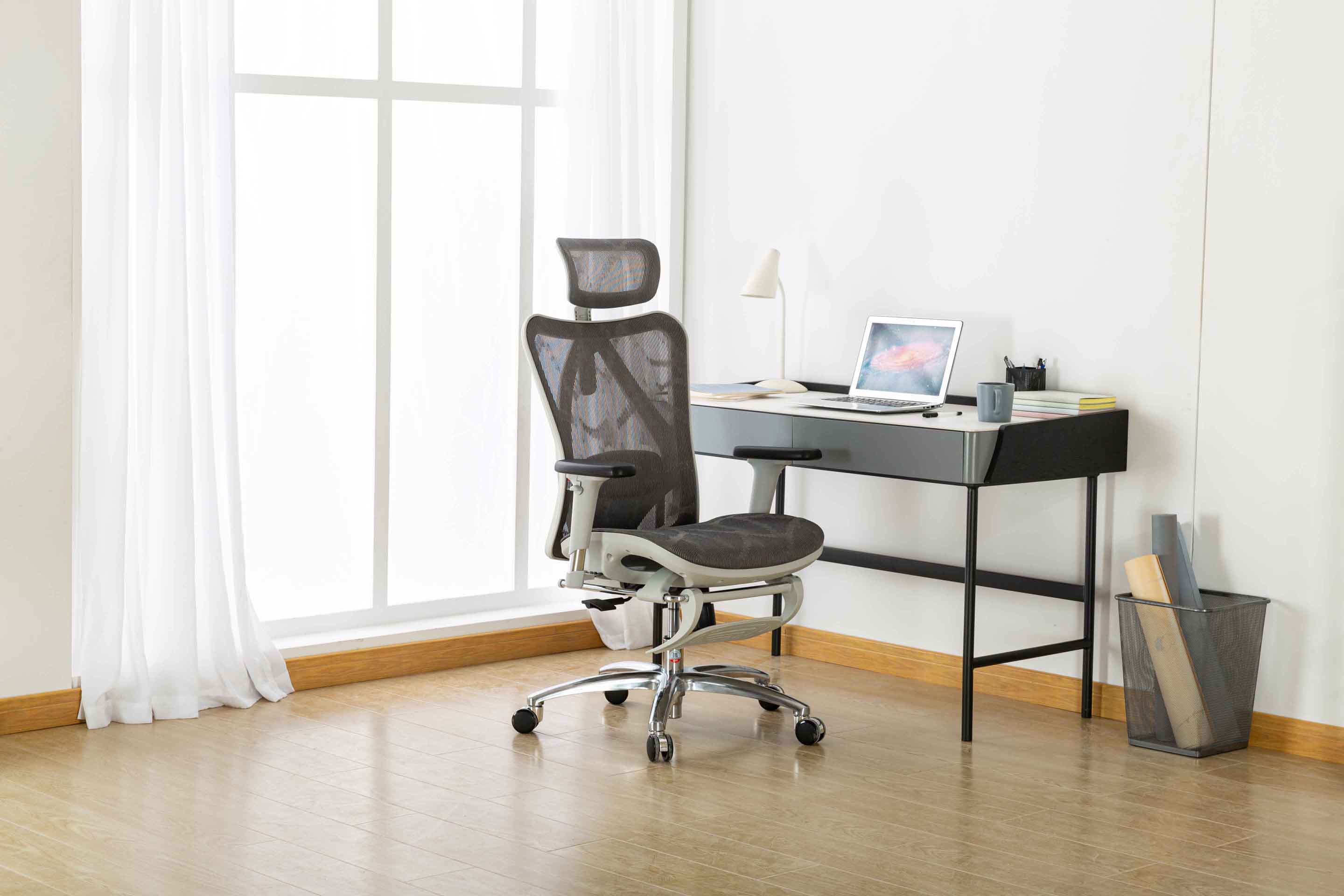 semi front right view of Sihoo M57 ergonomic chair in Australia with built-in footrest in a home office environment