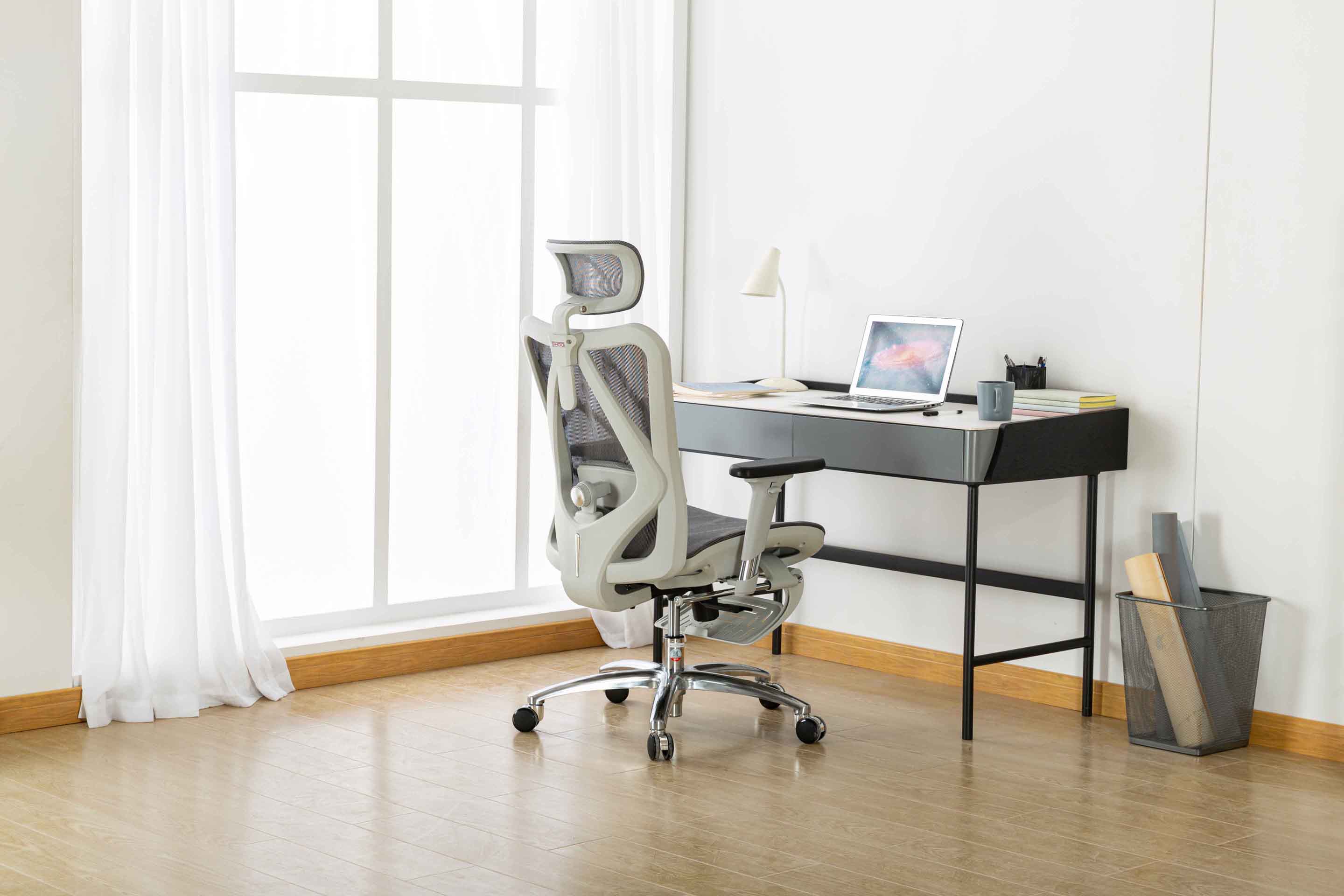Rear angled right view of Sihoo M57 ergonomic chair in Australia with built-in footrest in a modern home office setting
