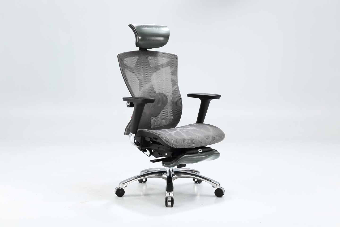 Semi front right view of black Sihoo V1 ergonomic chair in Australia with footrest on a gray background, highlighting adjustable armrests and lumbar support