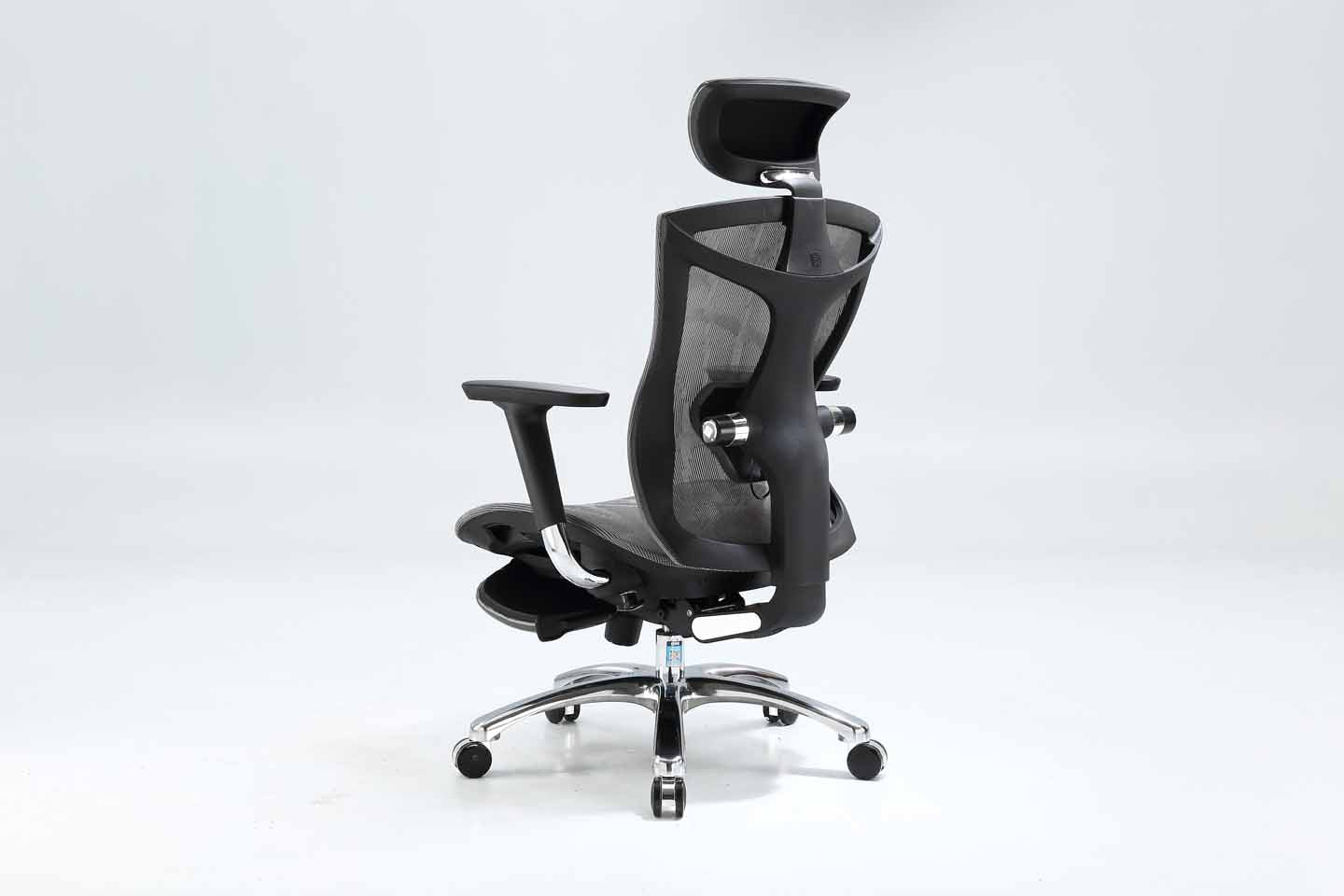 Black Sihoo V1 ergonomic chair in Australia from semi back left view with footrest on gray background, showcasing ergonomic comfort and adjustable features