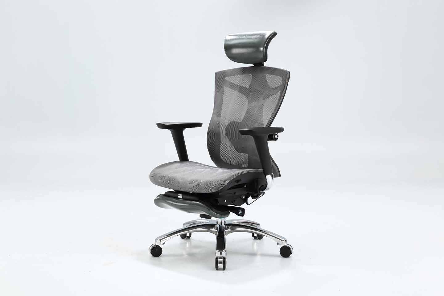 Black Sihoo V1 ergonomic chair in Australia from semi left view with footrest on gray background, showcasing ergonomic comfort and posture support
