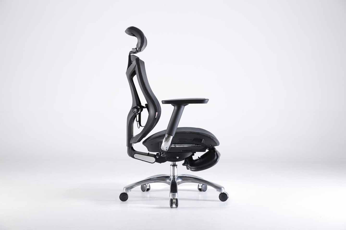 Right side view of black Sihoo V1 ergonomic chair in Australia with footrest on a gray background, highlighting adjustable armrests and lumbar support