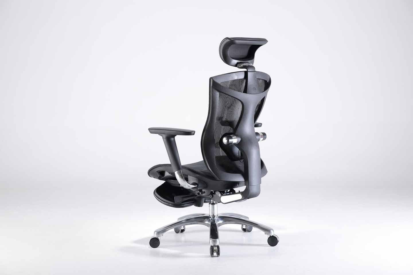 Semi back left angle of black Sihoo V1 ergonomic chair in Australia with footrest on gray background, emphasizing posture support and adjustable armrests