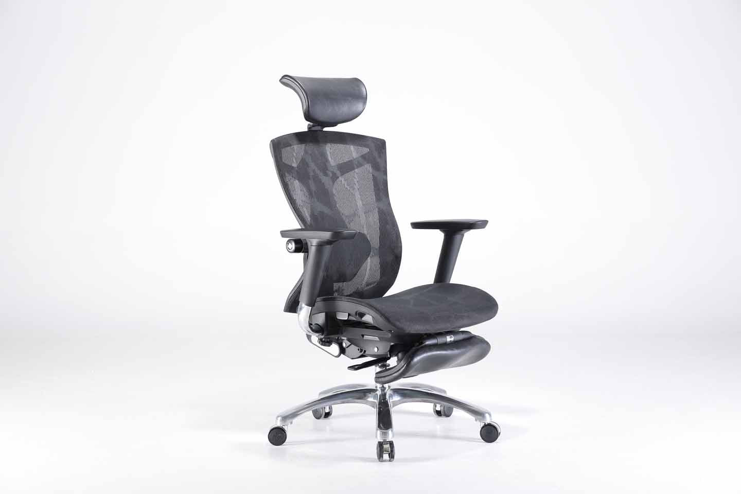 Semi front right angle of black Sihoo V1 ergonomic chair in Australia with footrest on gray background, showcasing adjustable armrests and posture support
