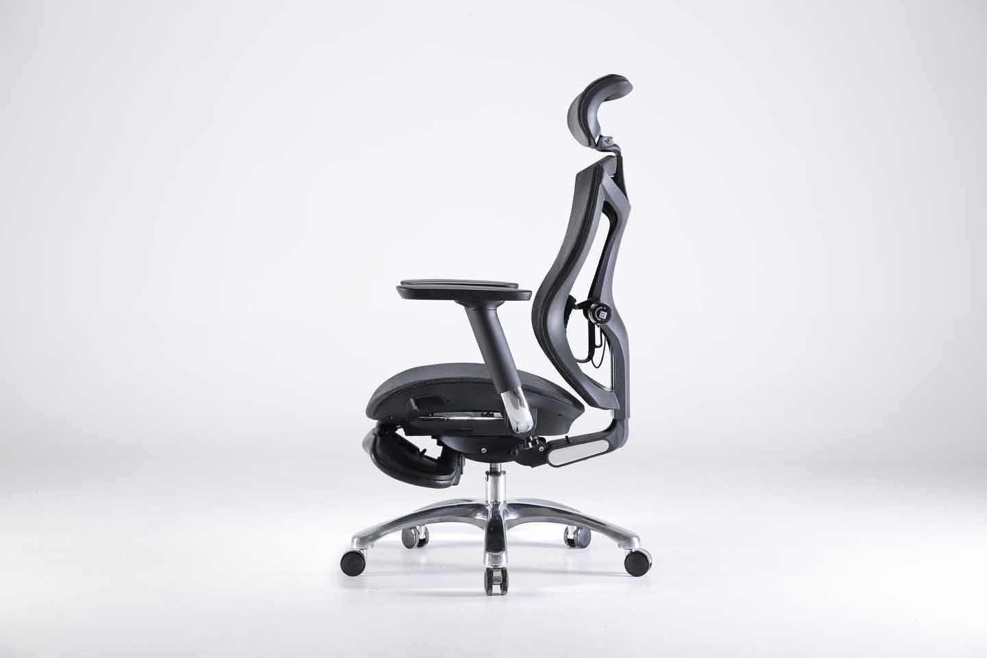 Left angle of black Sihoo V1 ergonomic chair in Australia with footrest on gray background, emphasizing posture support and ergonomic design