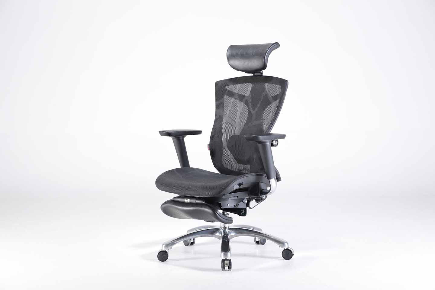 Semi front left view of black Sihoo V1 ergonomic chair in Australia with footrest on a gray background, highlighting adjustable armrests and lumbar support