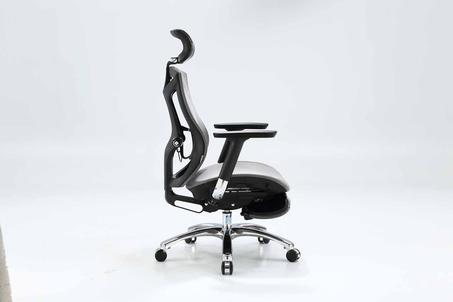 Black Sihoo V1 ergonomic chair in Australia shown from right view with footrest on gray background, emphasizing ergonomic comfort and posture support