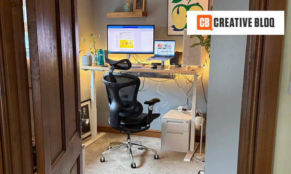 Home office setup with a budget-friendly ergonomic chair and standing desk, ideal for comfort and productivity.