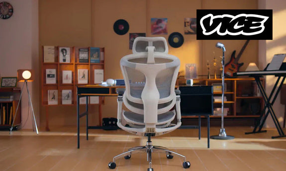 ack view of a SIHOO Doro C300 Pro ergonomic chair in a stylish home music studio setup with desk and guitar.