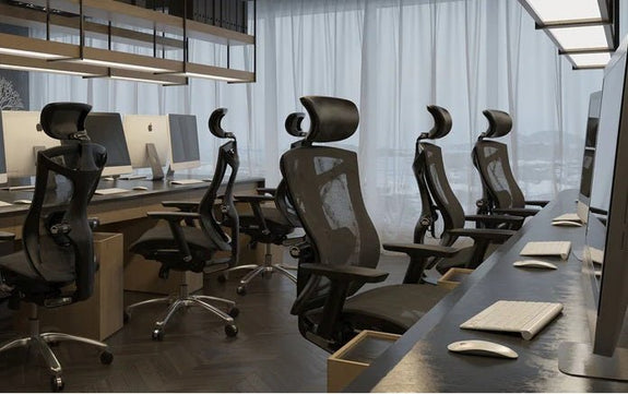 Ergonomic chairs arranged in a modern office workspace, demonstrating the benefits of ergonomic chair design for comfort, posture, and productivity.