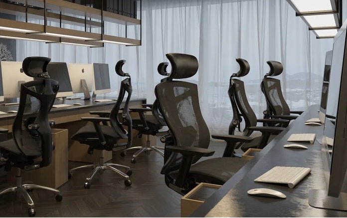 Ergonomic chairs arranged in a modern office workspace, demonstrating the benefits of ergonomic chair design for comfort, posture, and productivity.