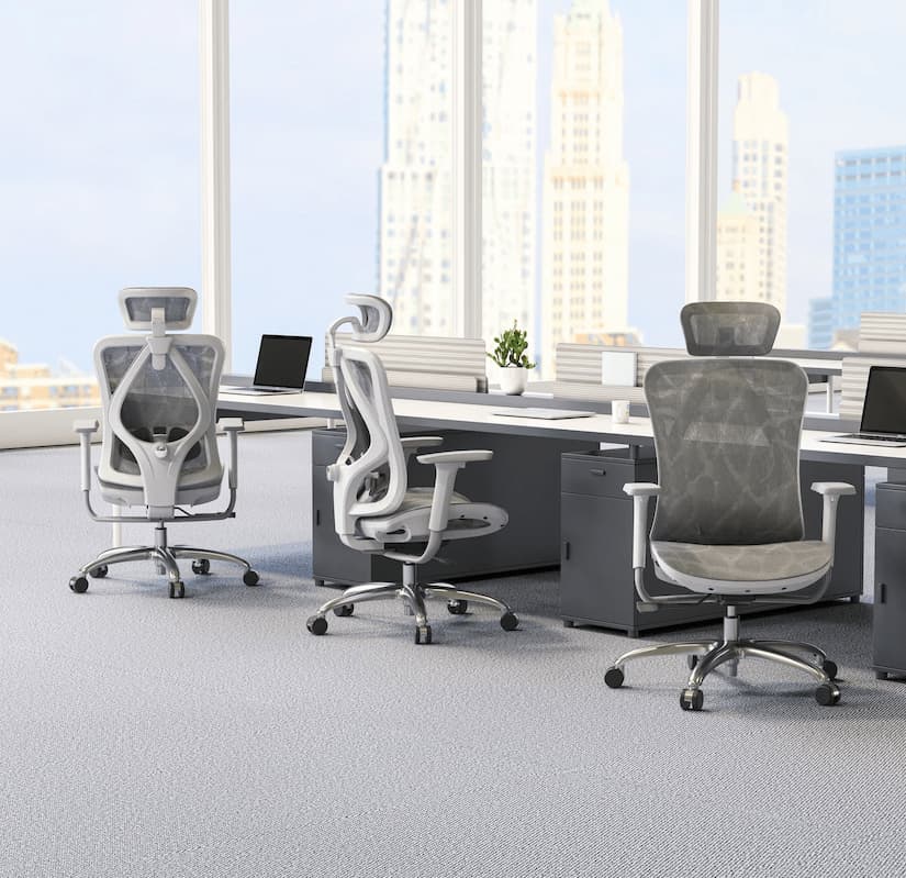 Modern office setup with ergonomic office chair for back pain, featuring mesh design, headrest, and lumbar support