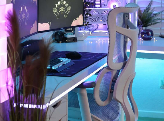 Modern gaming furniture setup featuring an ergonomic chair, RGB lighting, dual monitors, and a clean, stylish white desk layout.
