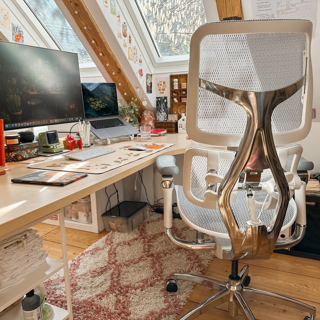Modern home office setup with ergonomic chair and wooden desk, perfect for transforming your space with a stylish home office makeover.