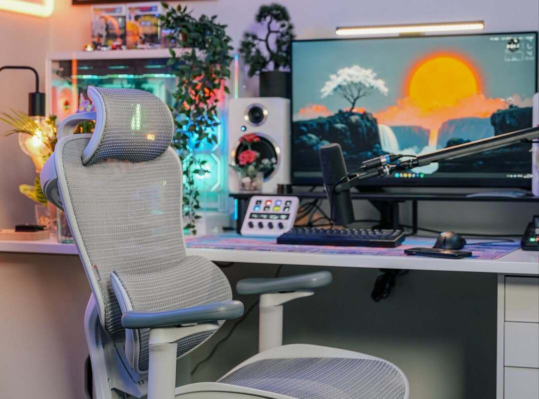 Sleek gaming setup with RGB lights and ergonomic chair offers modern home office styling ideas.