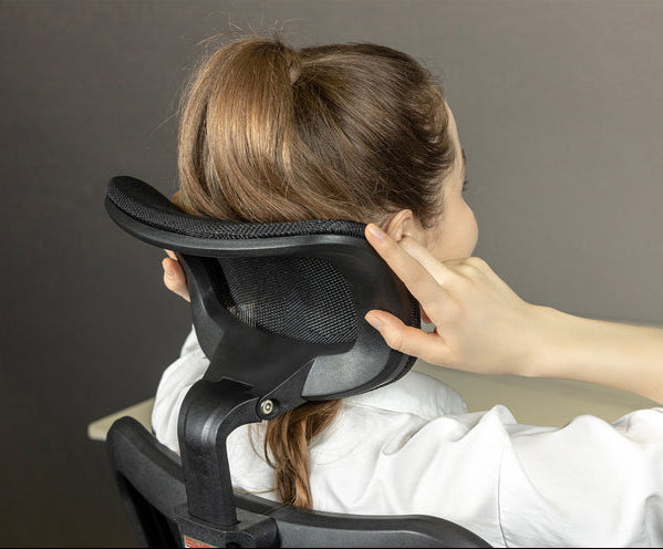 Close-up of woman resting head on Sihoo M18 ergonomic chair headrest in Australia showing neck support and comfort