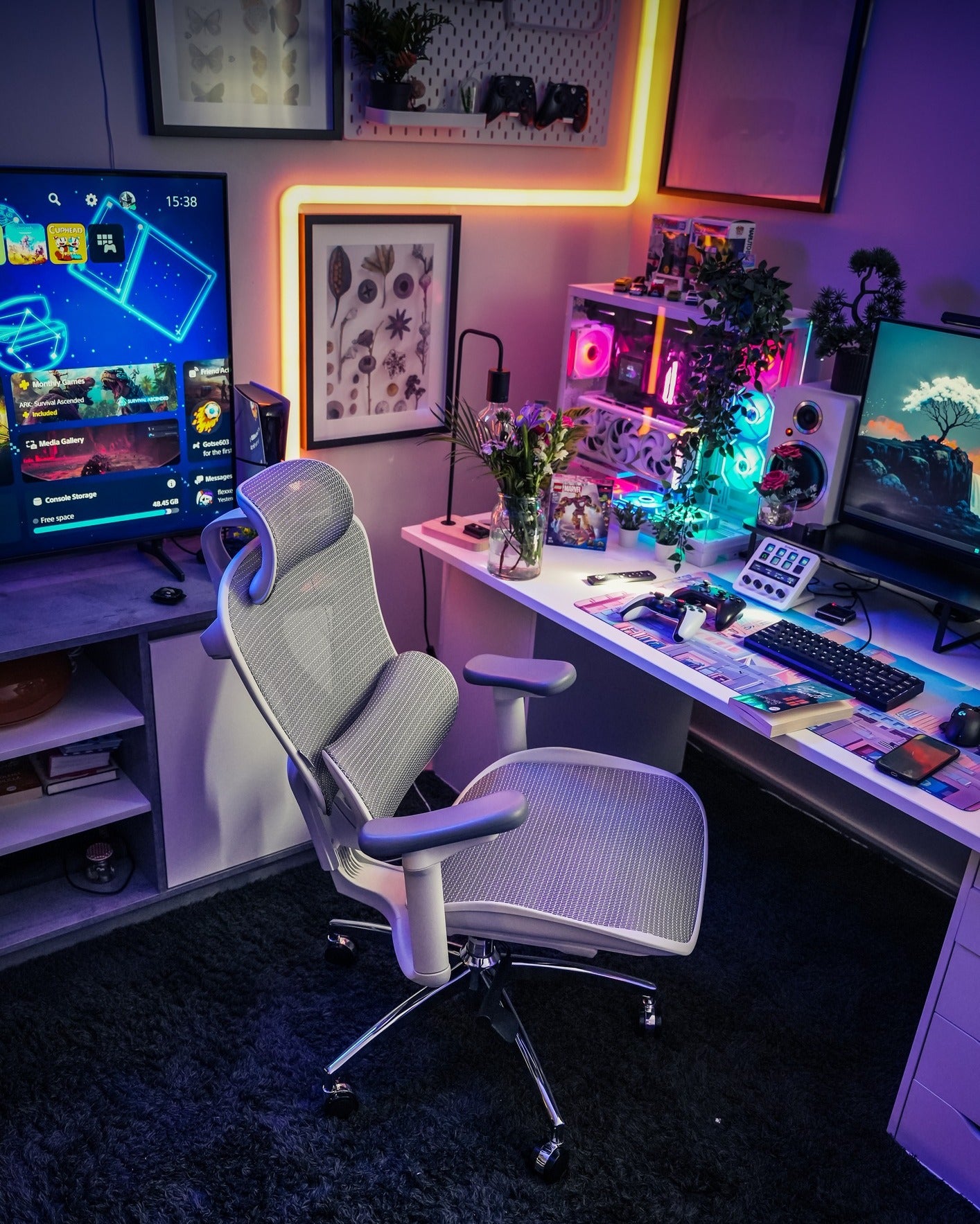 White and gray ergonomic chair in a room setup with LED lighting.