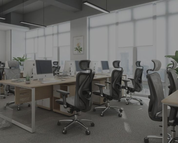 Office workspace with ergonomic chairs arranged in a modern setup.