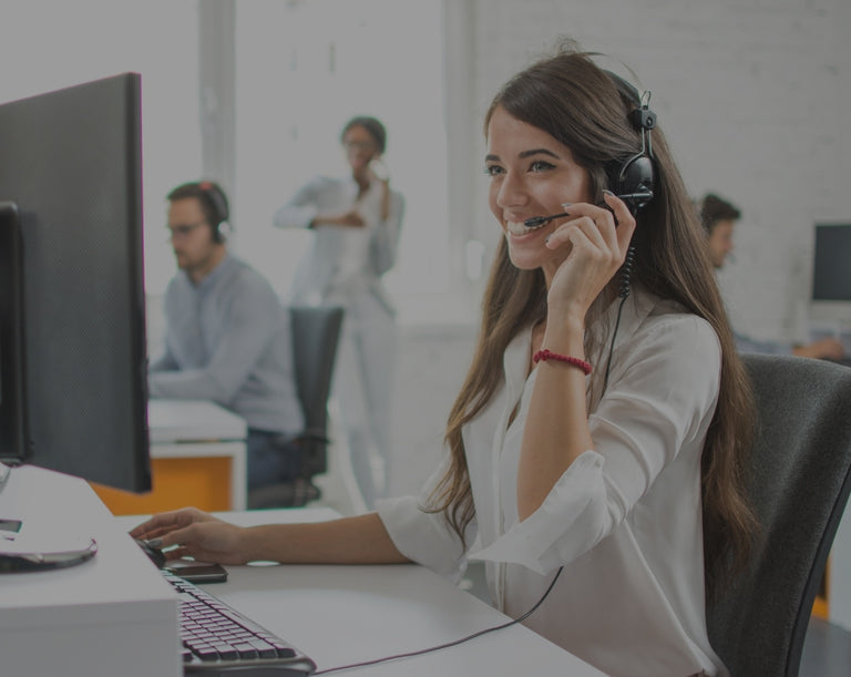 Banner image of a woman attending a virtual meeting while looking at a computer screen.