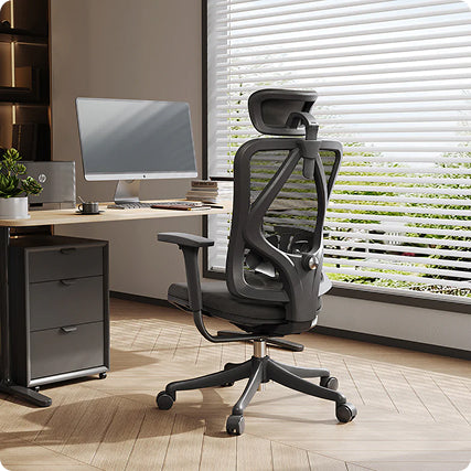 Black ergonomic chair in Australia designed for comfort and support, placed in a modern office workspace with desk and computer setup