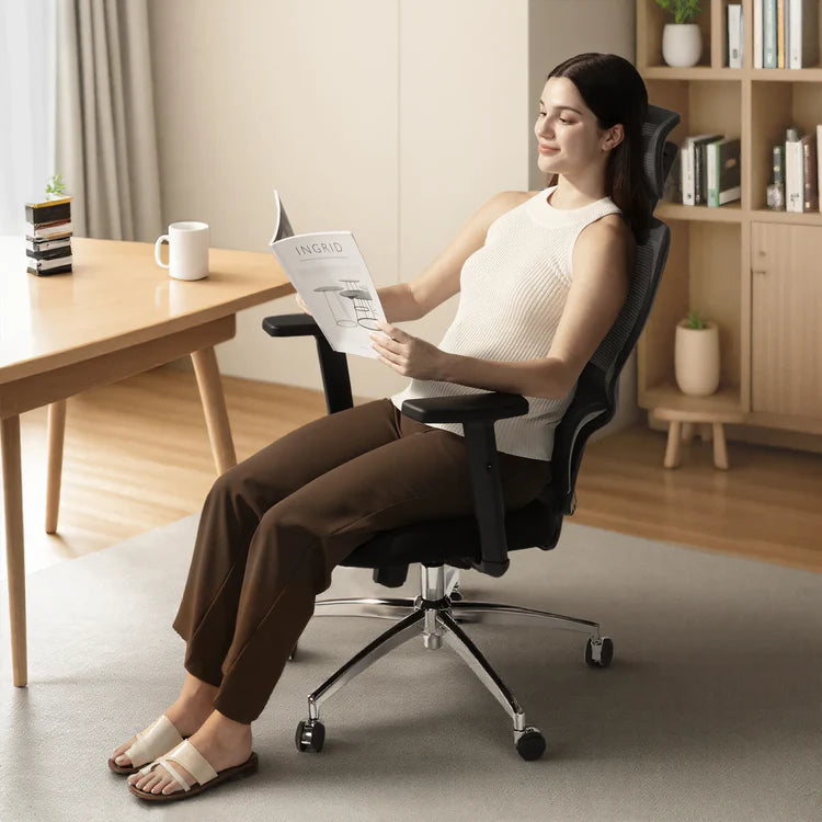 Woman reading a magazine while seated on an ergonomic chair in Australia.