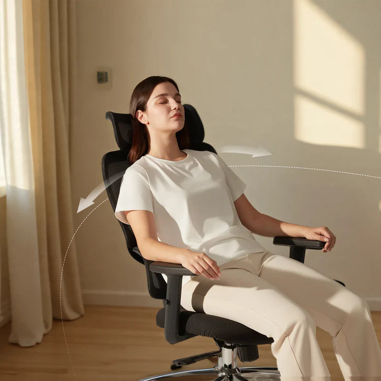 Woman sitting on ergonomic chair in Australia with arrow showing reclining function.